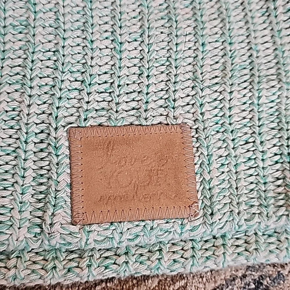 Love your melon teal and white beanie with leather patch